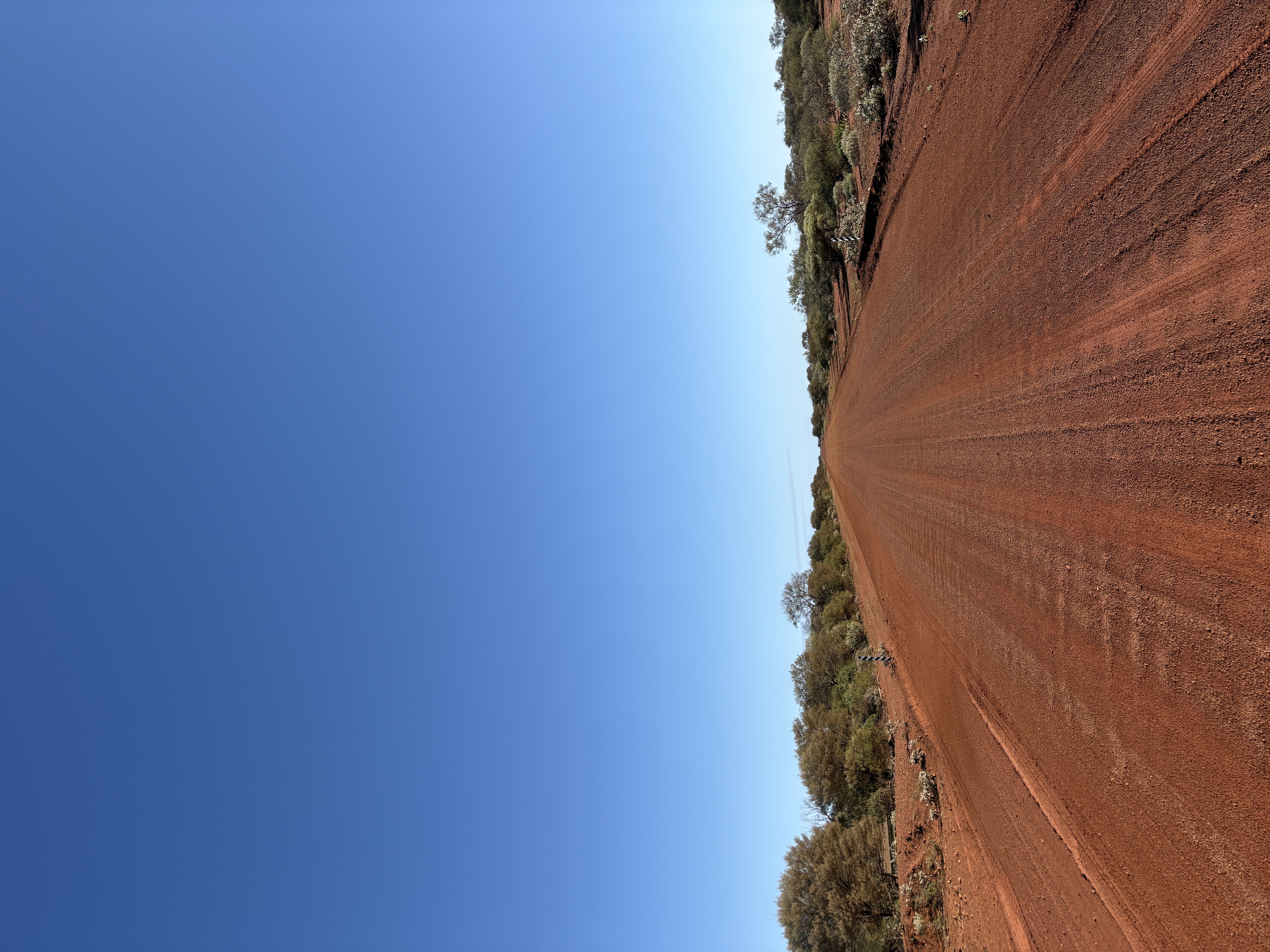 Empty outback road stretching to the horizon